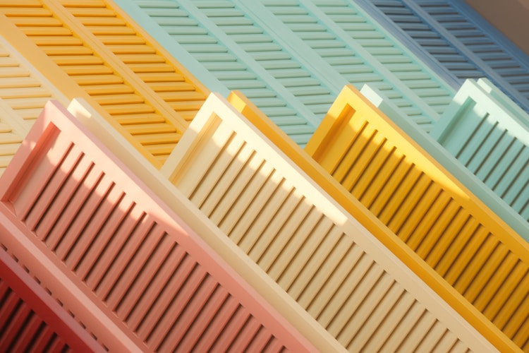 A close up of a row of different colored trays
