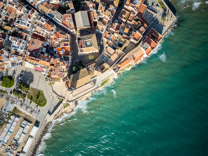 An aerial view of a city next to the ocean