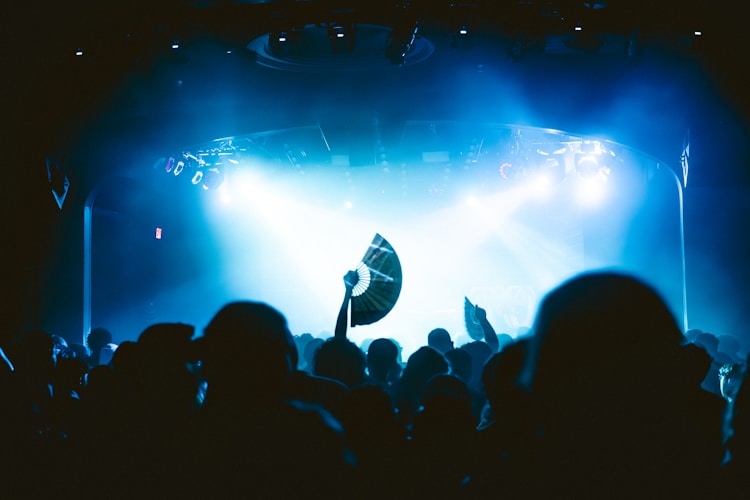 A concert stage is lit up in blue.