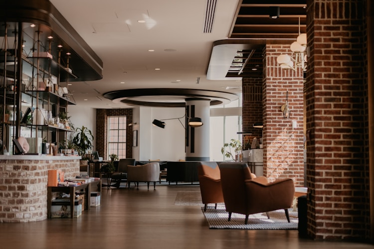 A cozy, modern interior with brick and warm lighting.