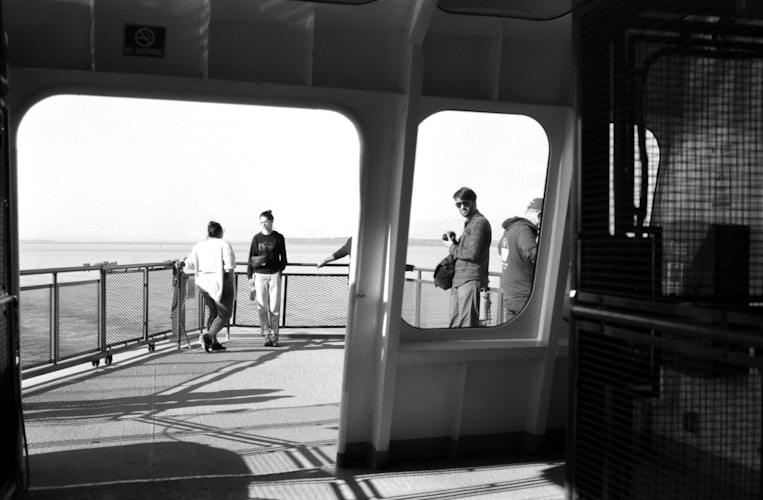 People stand on the deck of a ship.