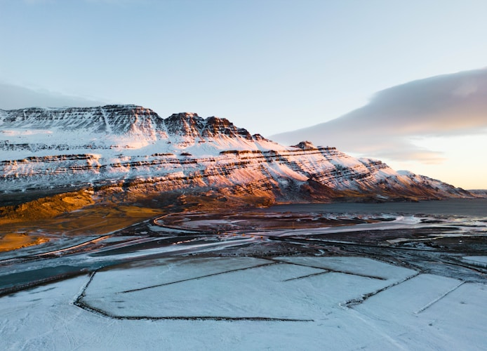 Snowy mountain illuminated by sunlight.