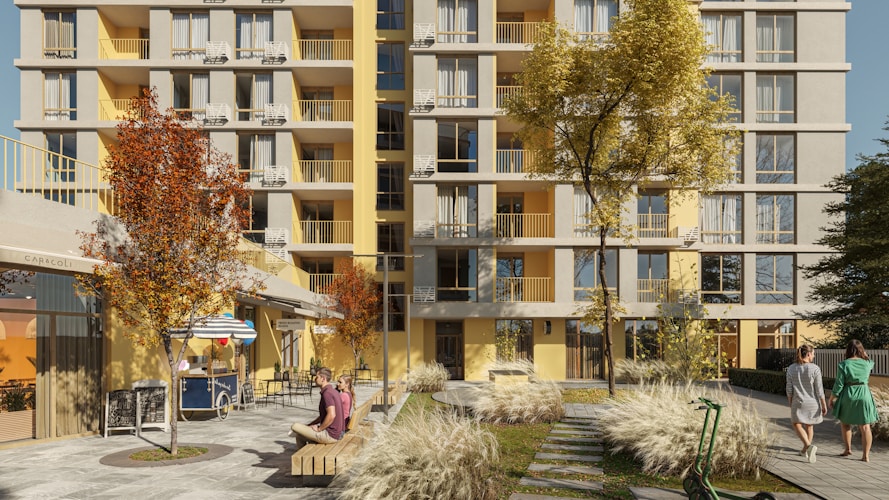 A modern apartment building surrounded by trees.