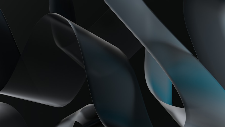 Abstract ribbons swirl across a dark background.