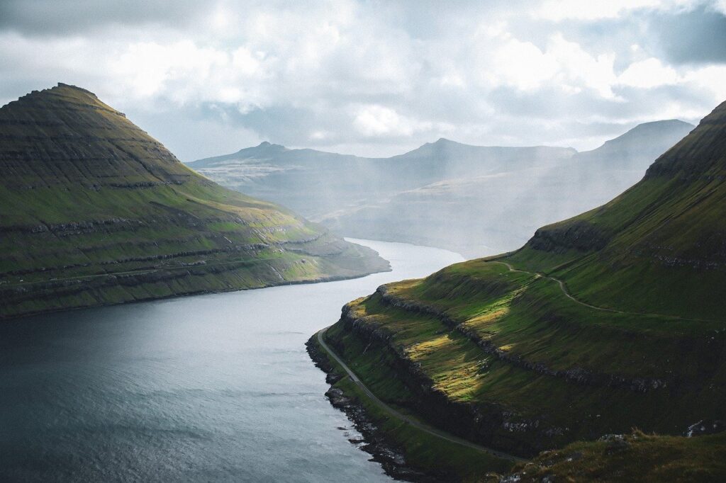 faroe islands, fjord, mountains, green, water, valley, sunbeams, clouds, heaven, nature, landscape, north atlantic, unaffected, majestic, wild, coast, panorama, light and shadow, idyllic, adventure
